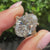 Oval solitaire engagement ring with round hidden halo
