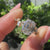 Nature inspired engagement ring with old mine emerald cut center
