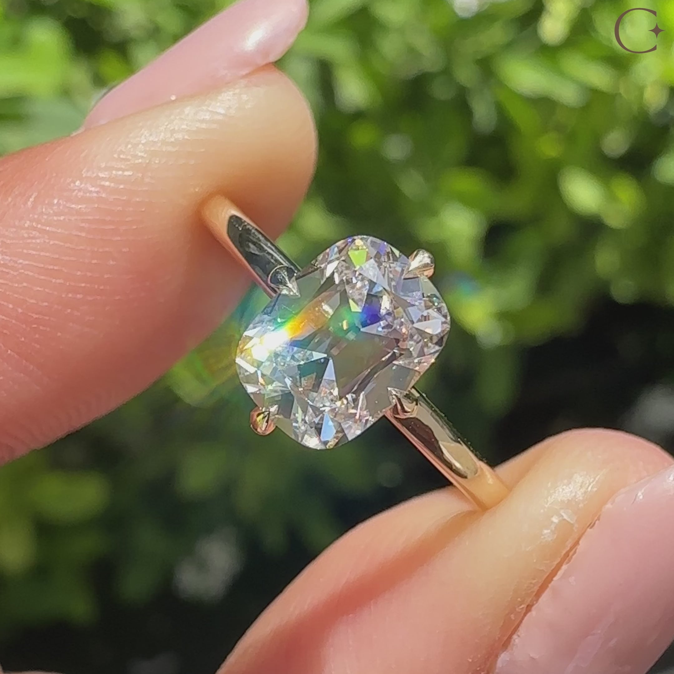 Solitaire cushion diamond ring with compass claw prong setting
