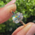 Solitaire cushion diamond ring with compass claw prong setting

