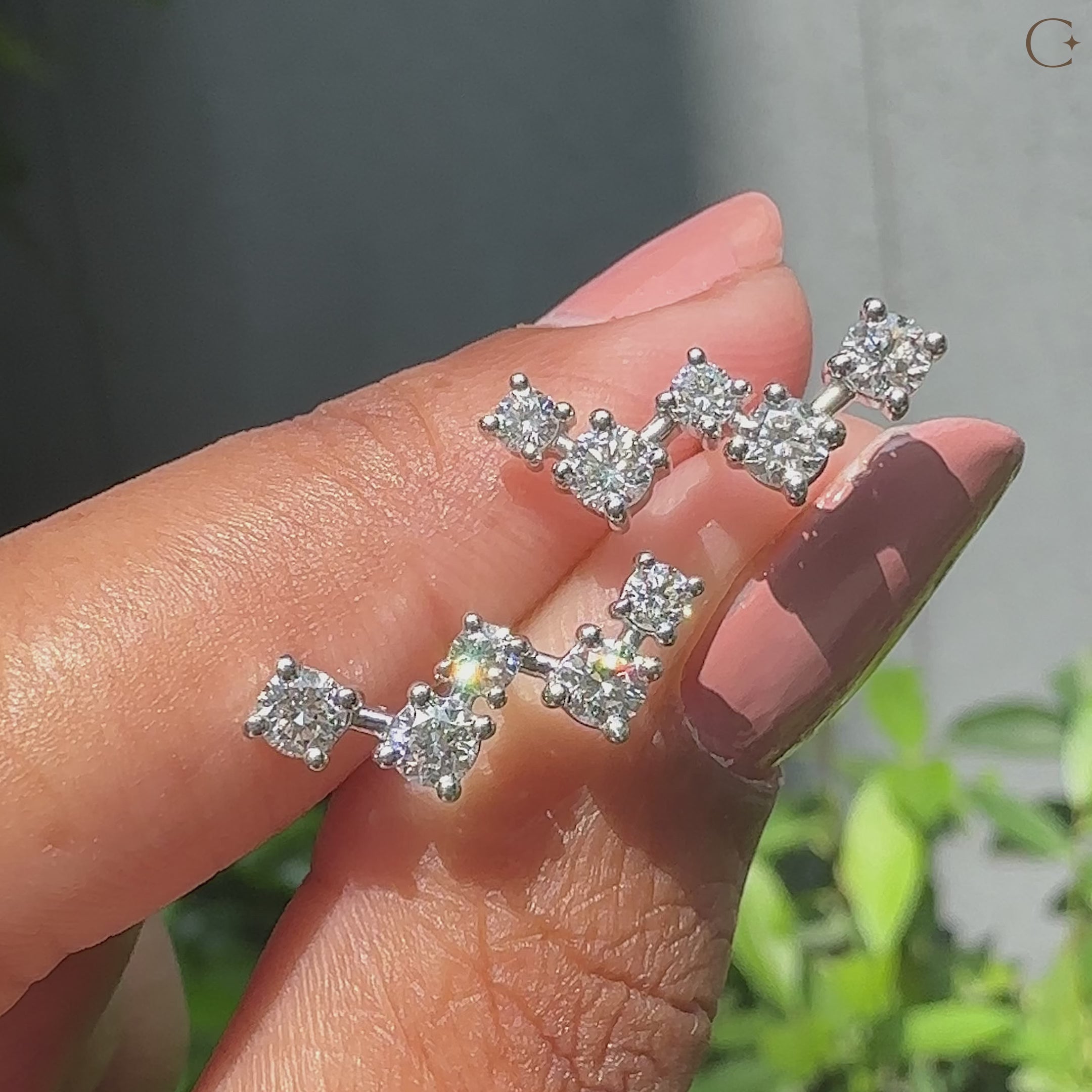 Stud diamond earrings featuring round cut diamonds handcrafted by caratdiamonds
