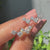 Stud diamond earrings featuring round cut diamonds handcrafted by caratdiamonds
