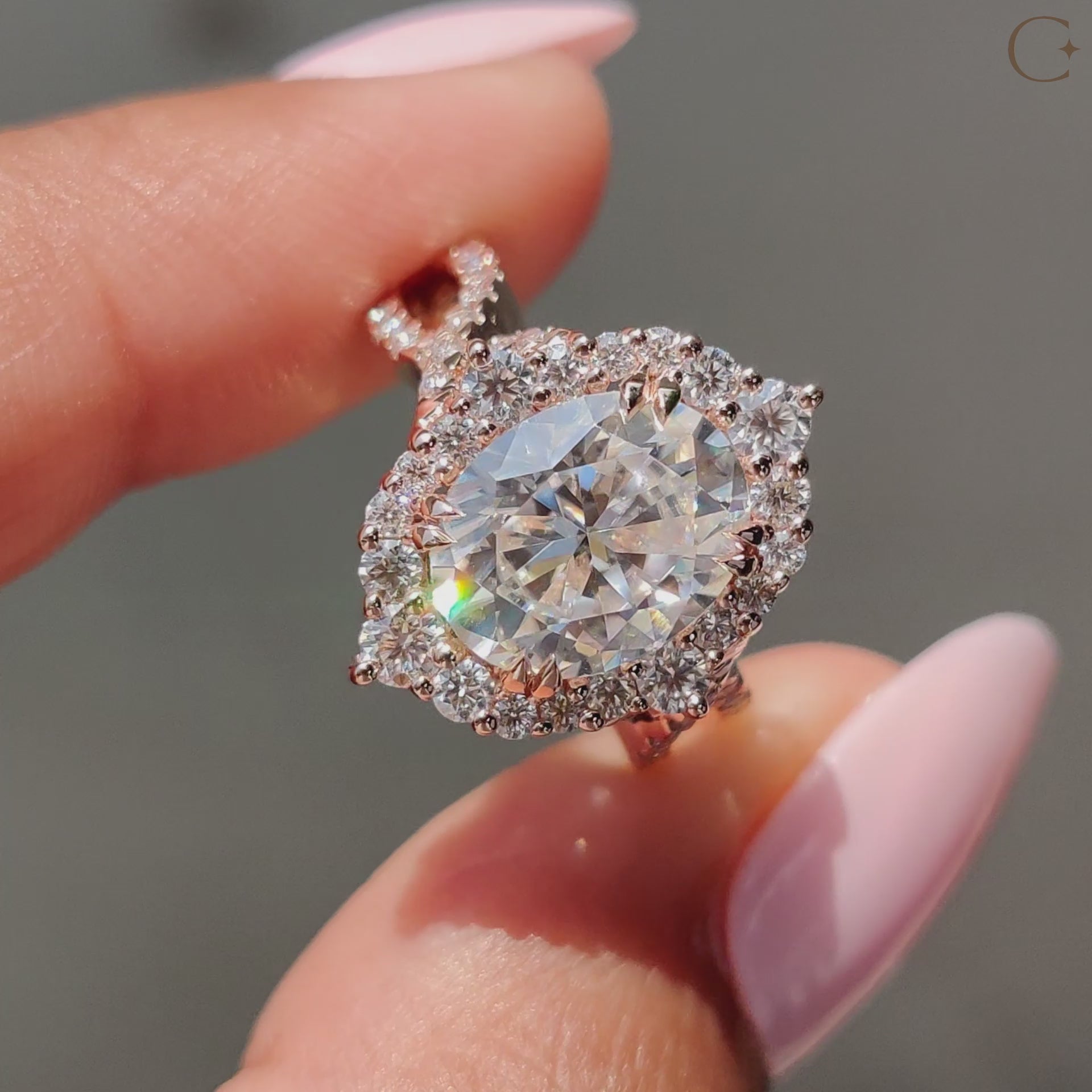 Oval cut engagement ring set in rose gold with a bold shape.
