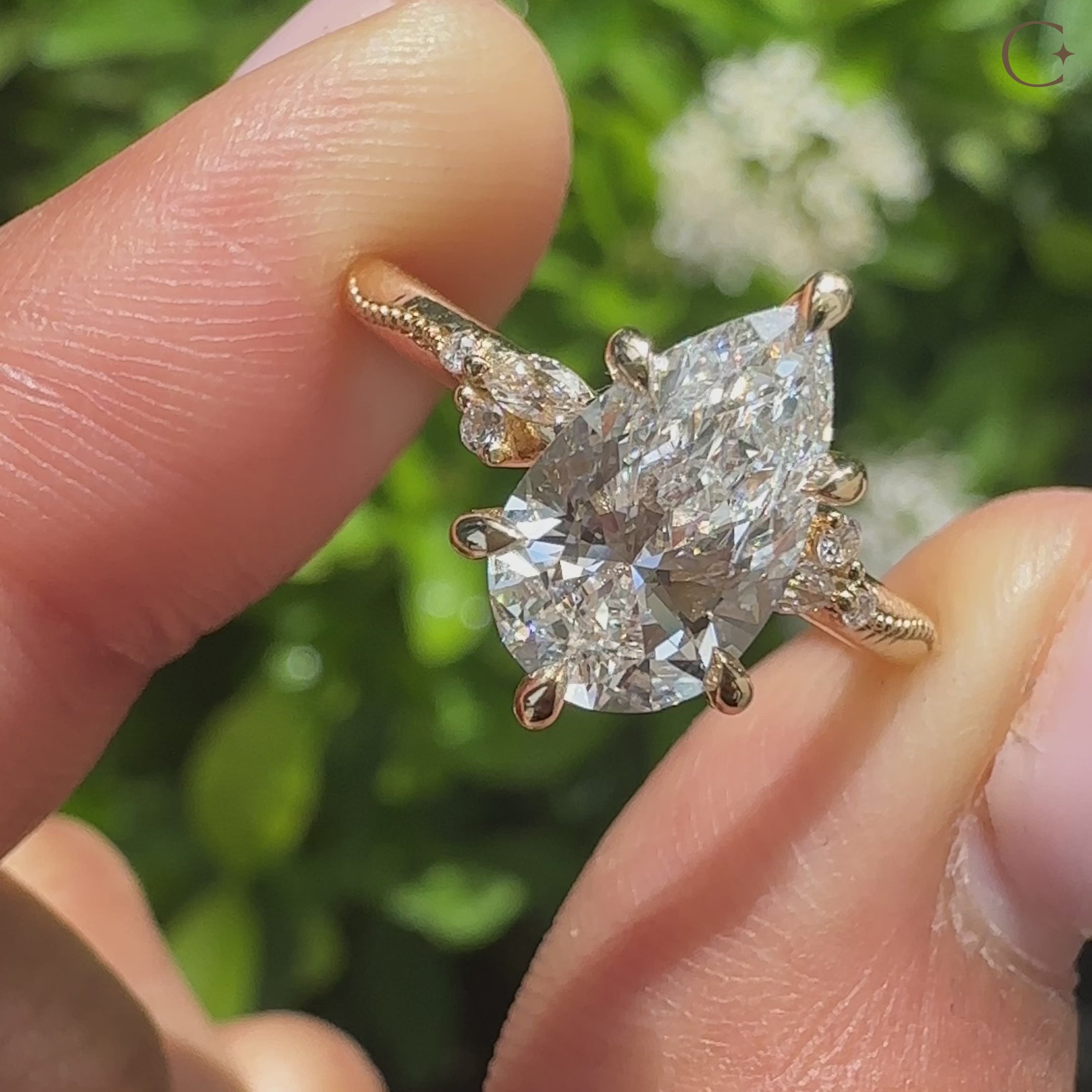 Pear cut diamond ring with milgrain and claw setting
