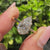 Pear diamond engagement ring with hidden halo detail.

