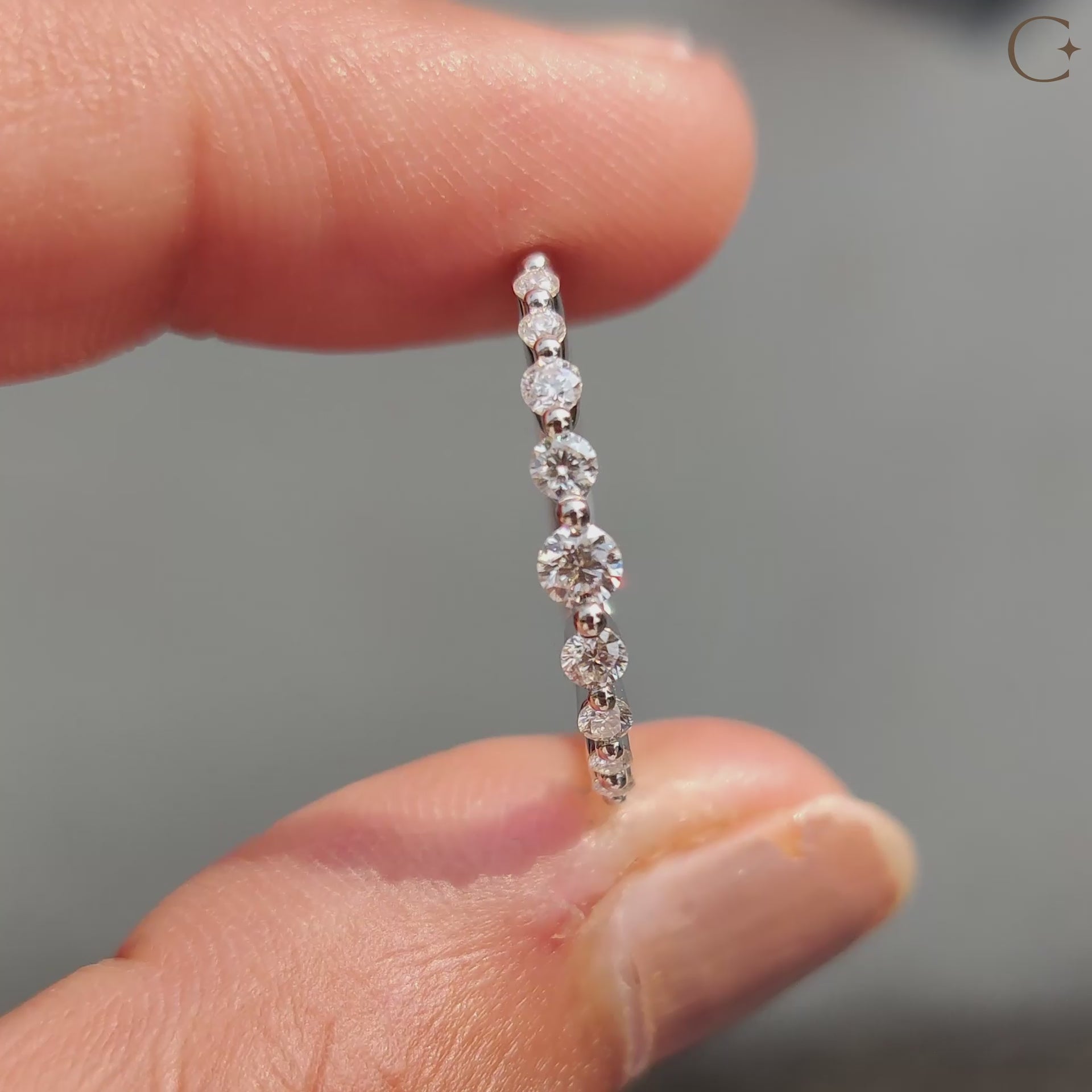 Elegant round diamond band in white gold.
