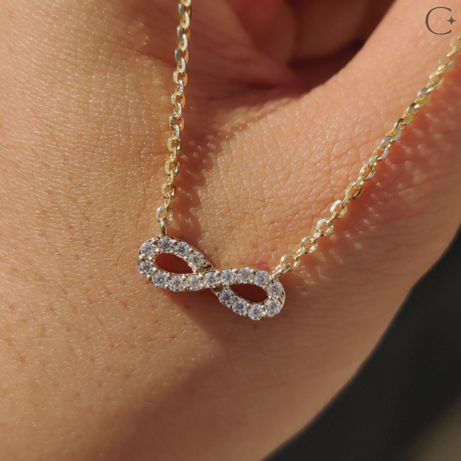 Round cut diamond pendant in yellow gold setting.