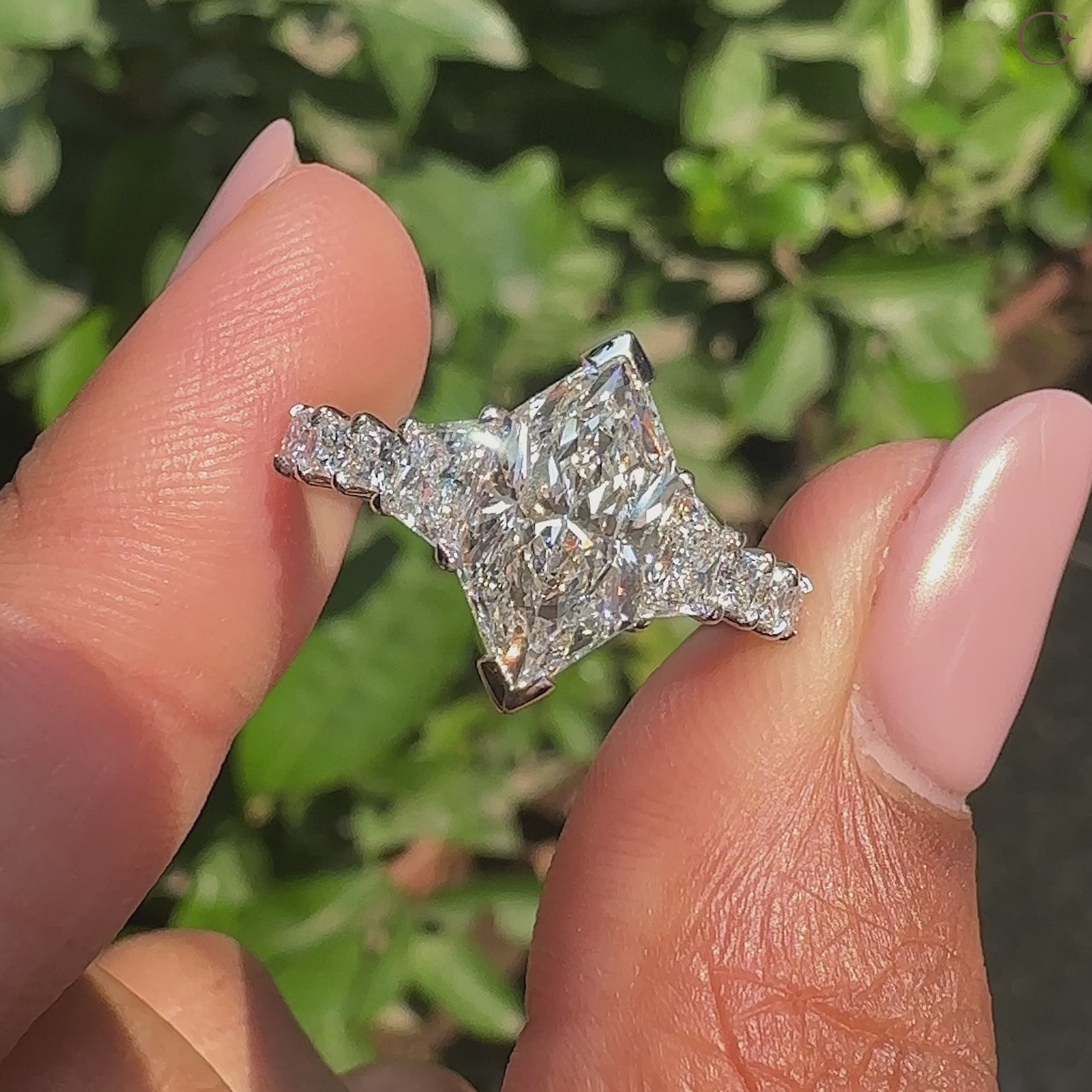 Custom white gold diamond ring with dutch marquise center stone.
