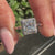 Princess cut diamond ring with round halo
