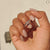 A custom wedding band complements the simple wedding band beautifully.