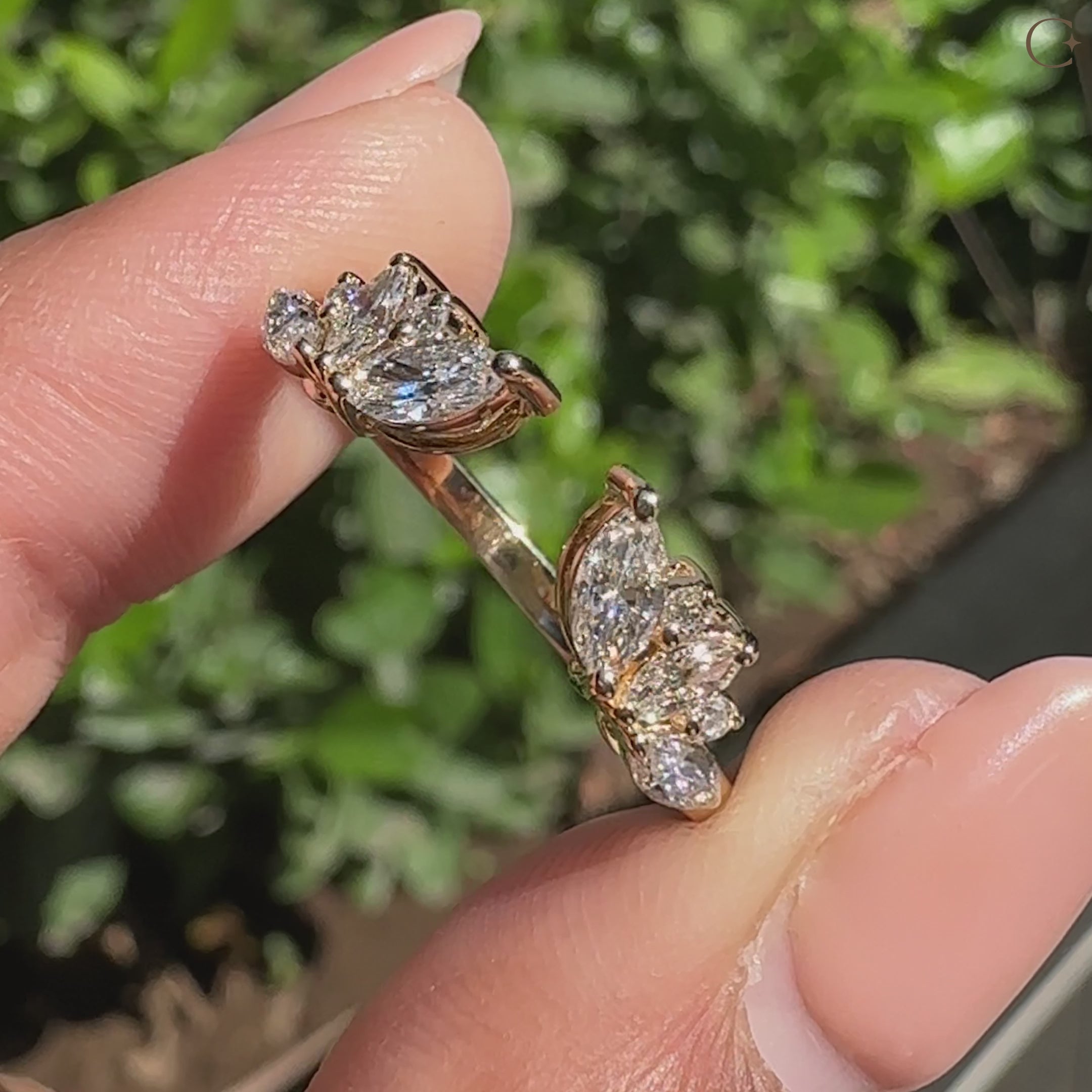 Handmade open gap wedding band featuring marquise and round diamond.
