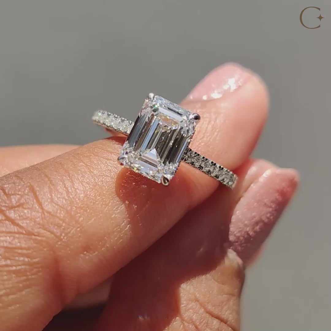 Elegant hidden halo ring with a sparkling center diamond.