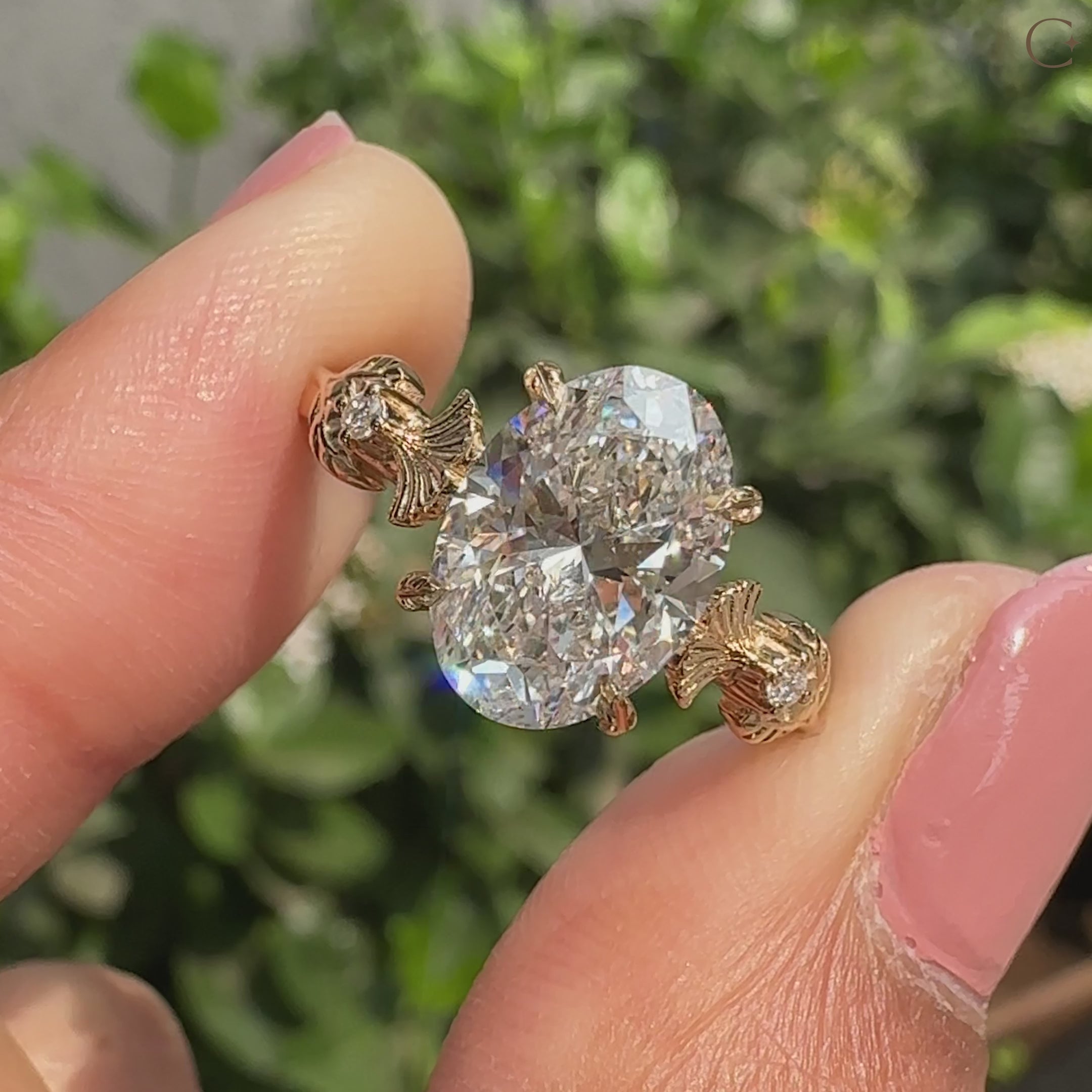 Handmade oval diamond ring with round side stones
