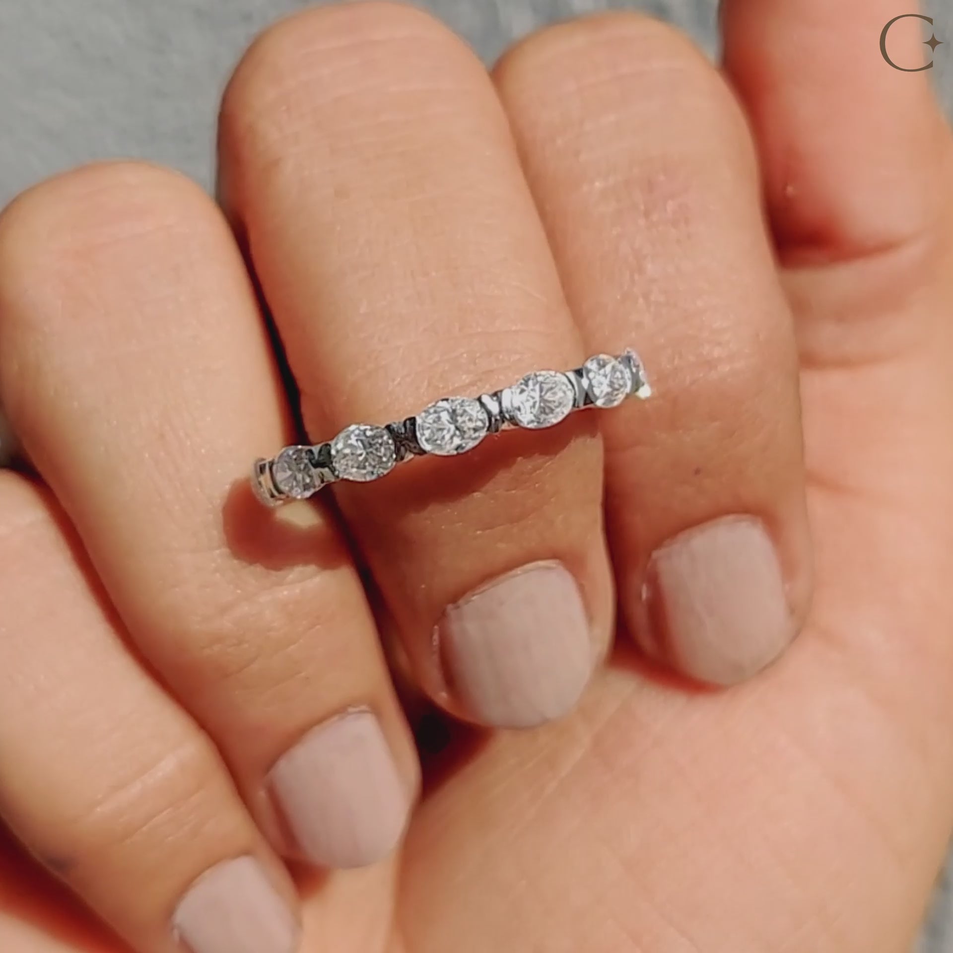 East West oval wedding band with horizontal-set stones, offering a bold and modern twist.