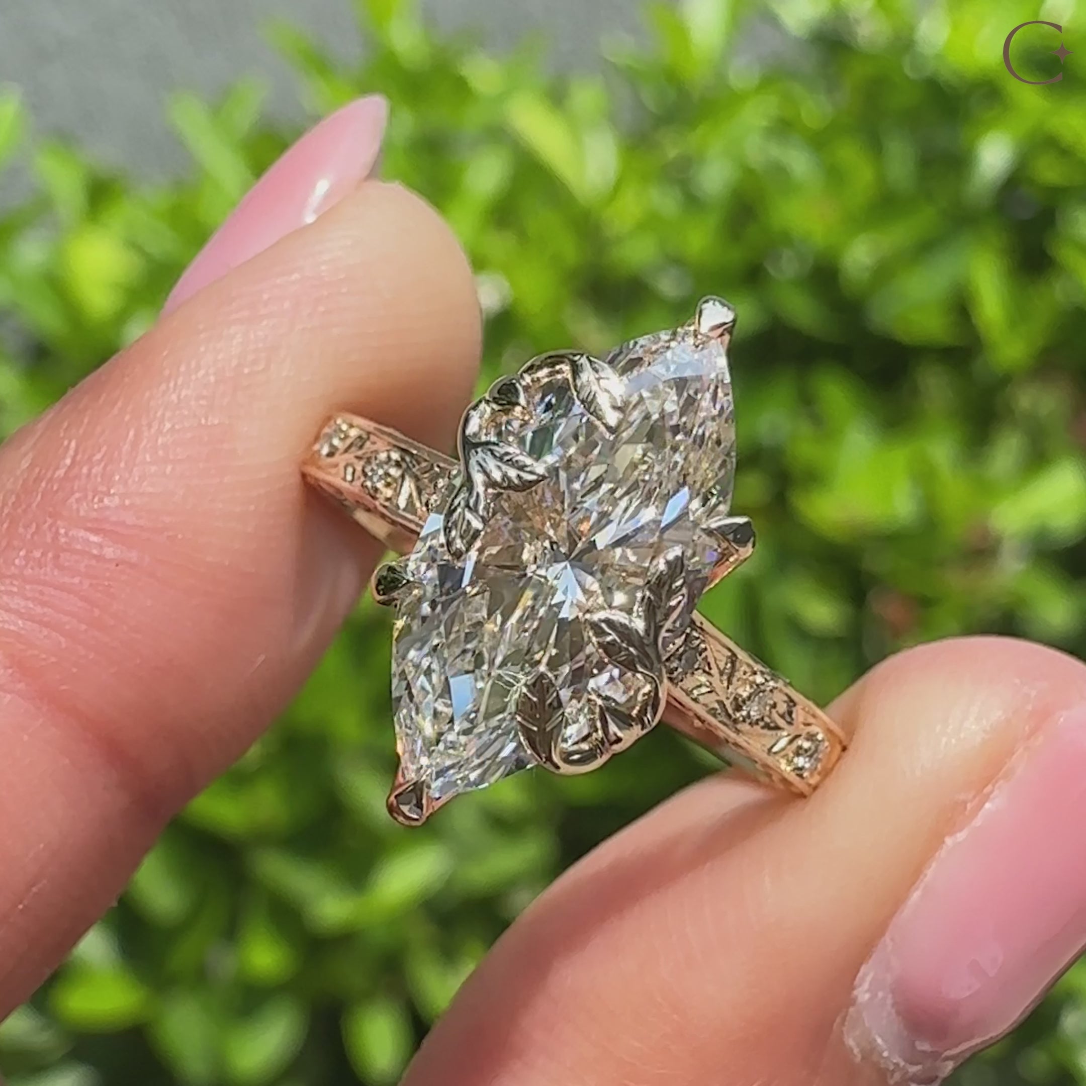 Nature inspired marquise engagement ring with floral design.
