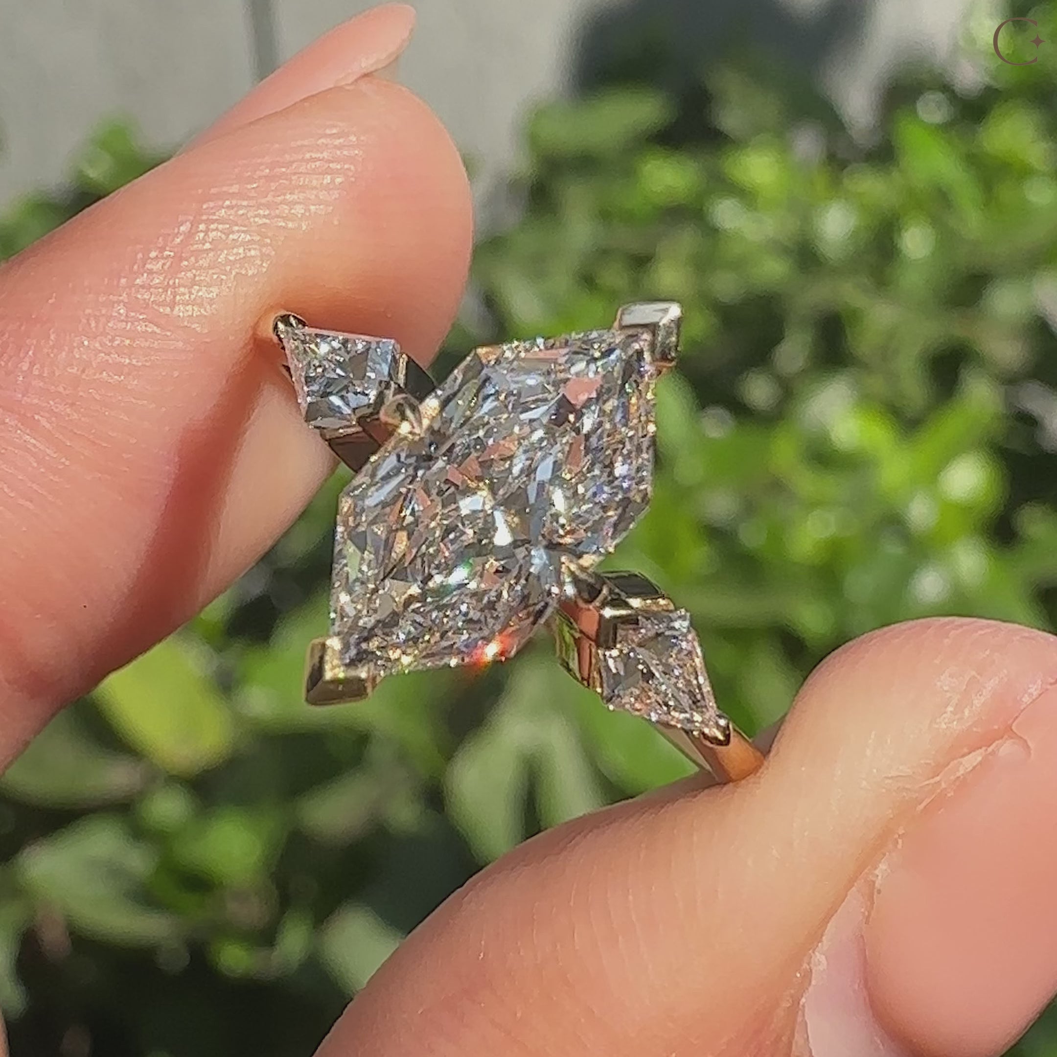 Handmade three diamond ring featuring dutch marquise center stone.
