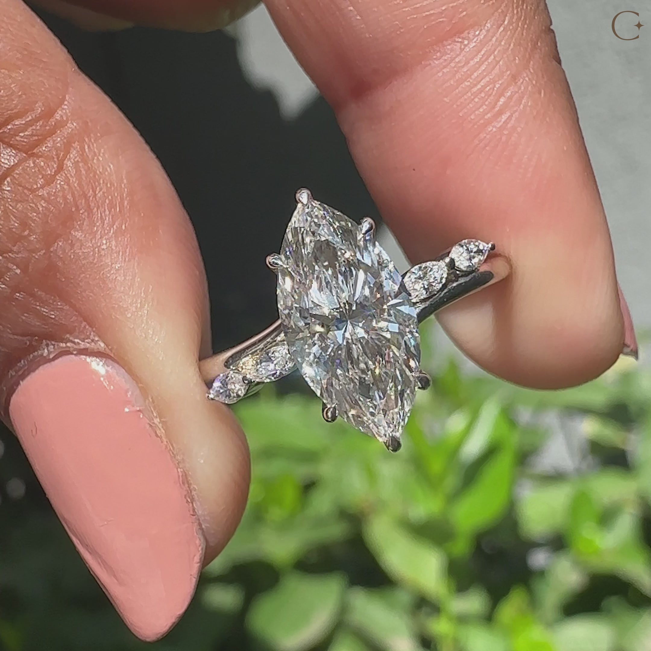 Hidden halo engagement ring in cathedral setting ring style.