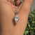 Handmade spear cut moissanite pendant in bezel style.
