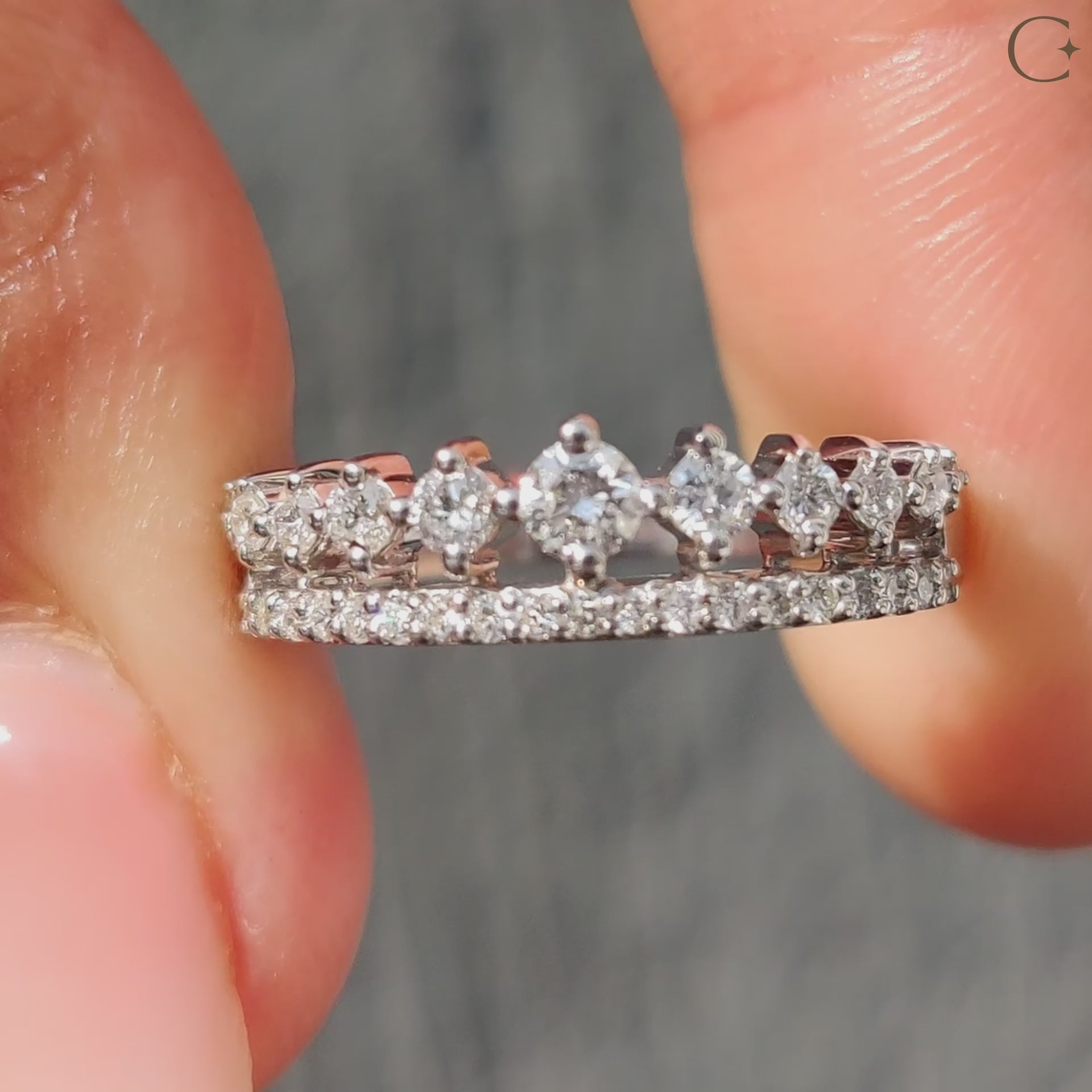 Elegant white gold wedding band displayed on a velvet box.
