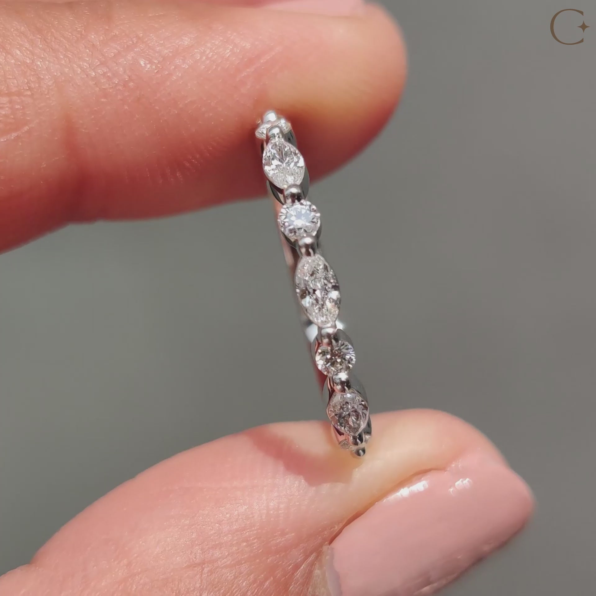 Marquise and round diamond band featuring stunning contrasts.
