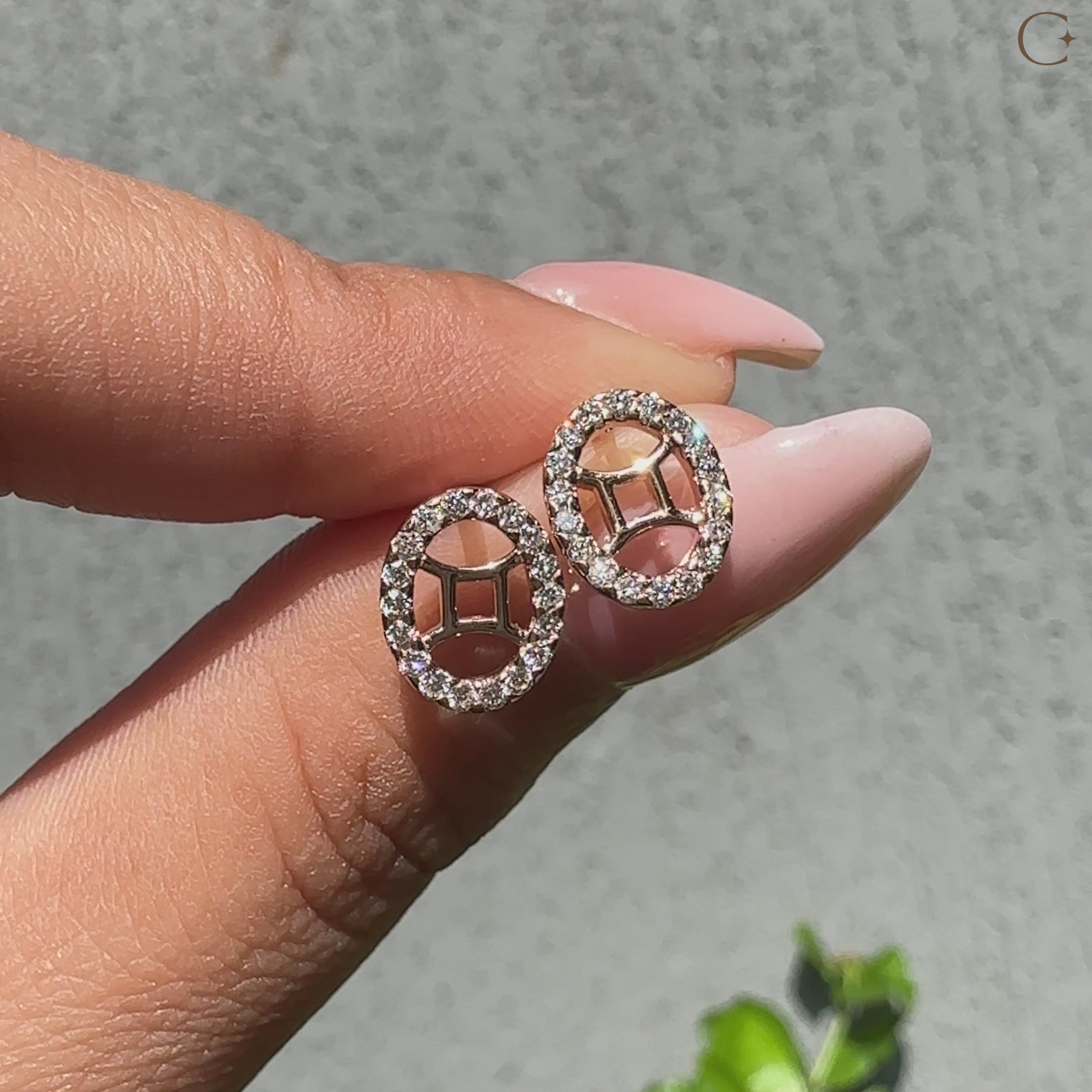 Handmade Gemini stud earrings featuring halo setting diamonds.
