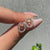 Handmade Gemini stud earrings featuring halo setting diamonds.
