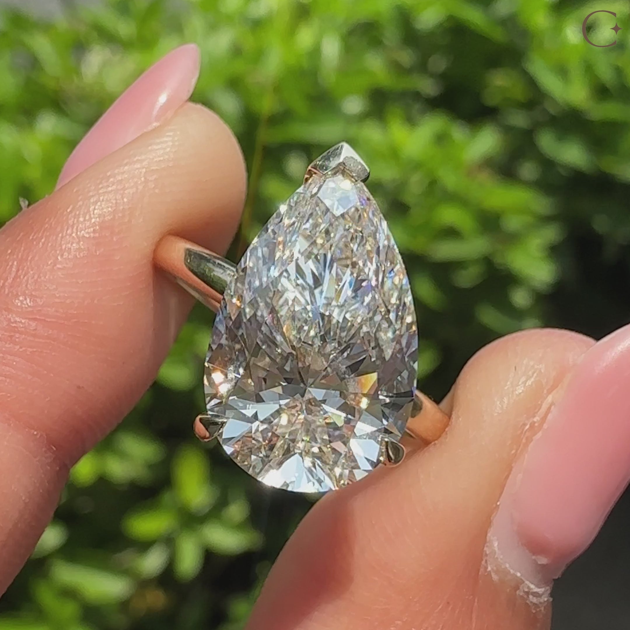 Pear cut lab grown diamond ring with V prong setting.
