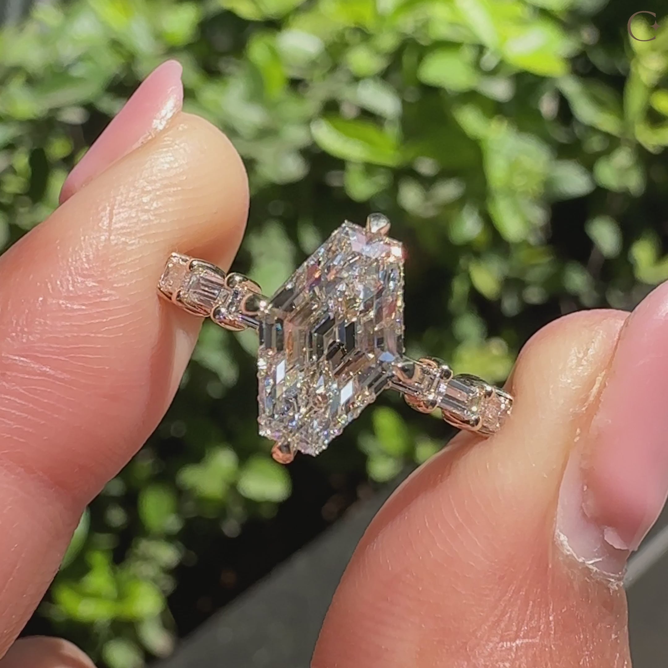 Carat Diamonds hexagon ring with compass prong setting.