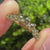 Green Round Diamond Half Eternity Wedding Band in Chevron Style