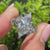 Nature inspired marquise diamond ring with leaf detail accents.

