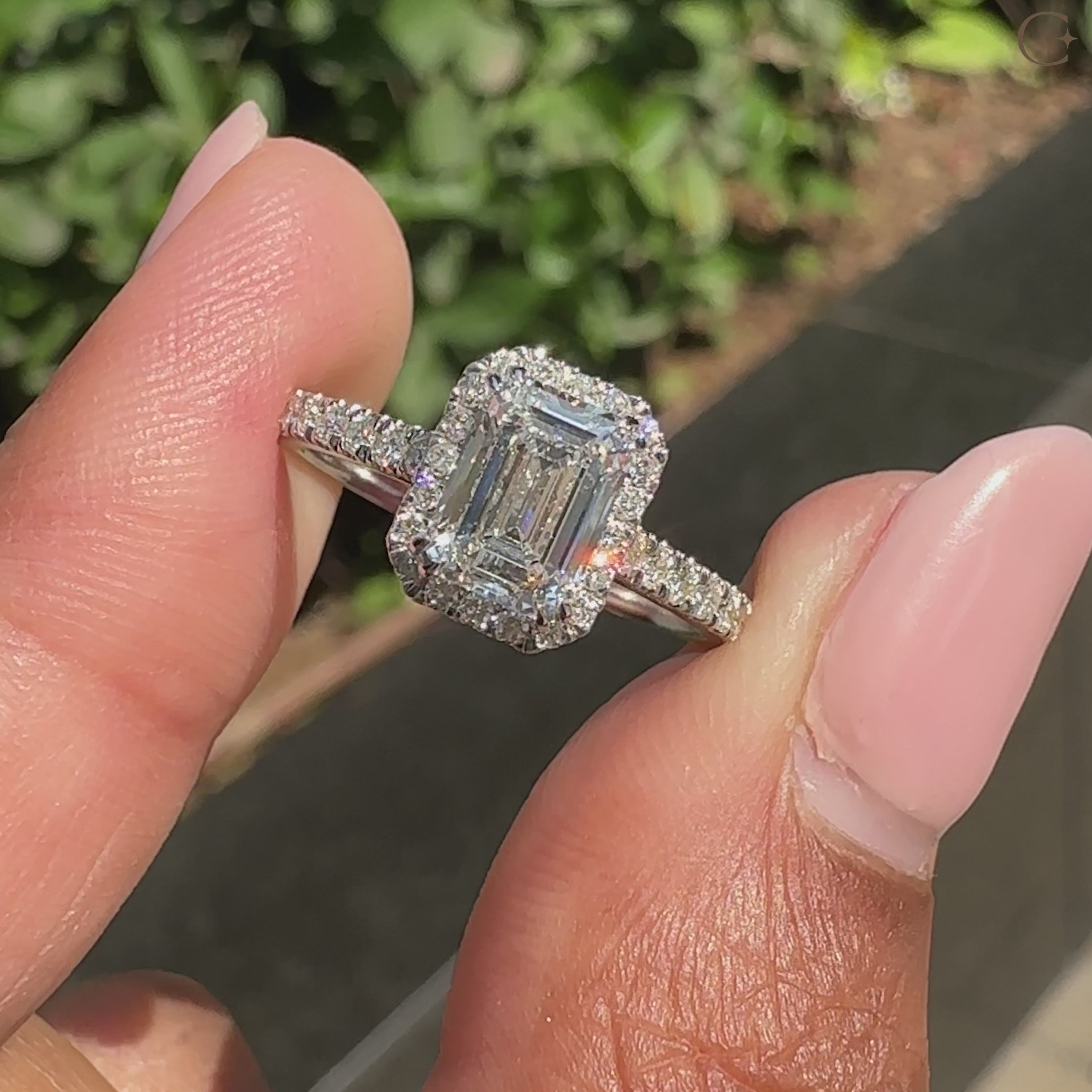Cathedral setting emerald cut diamond ring
