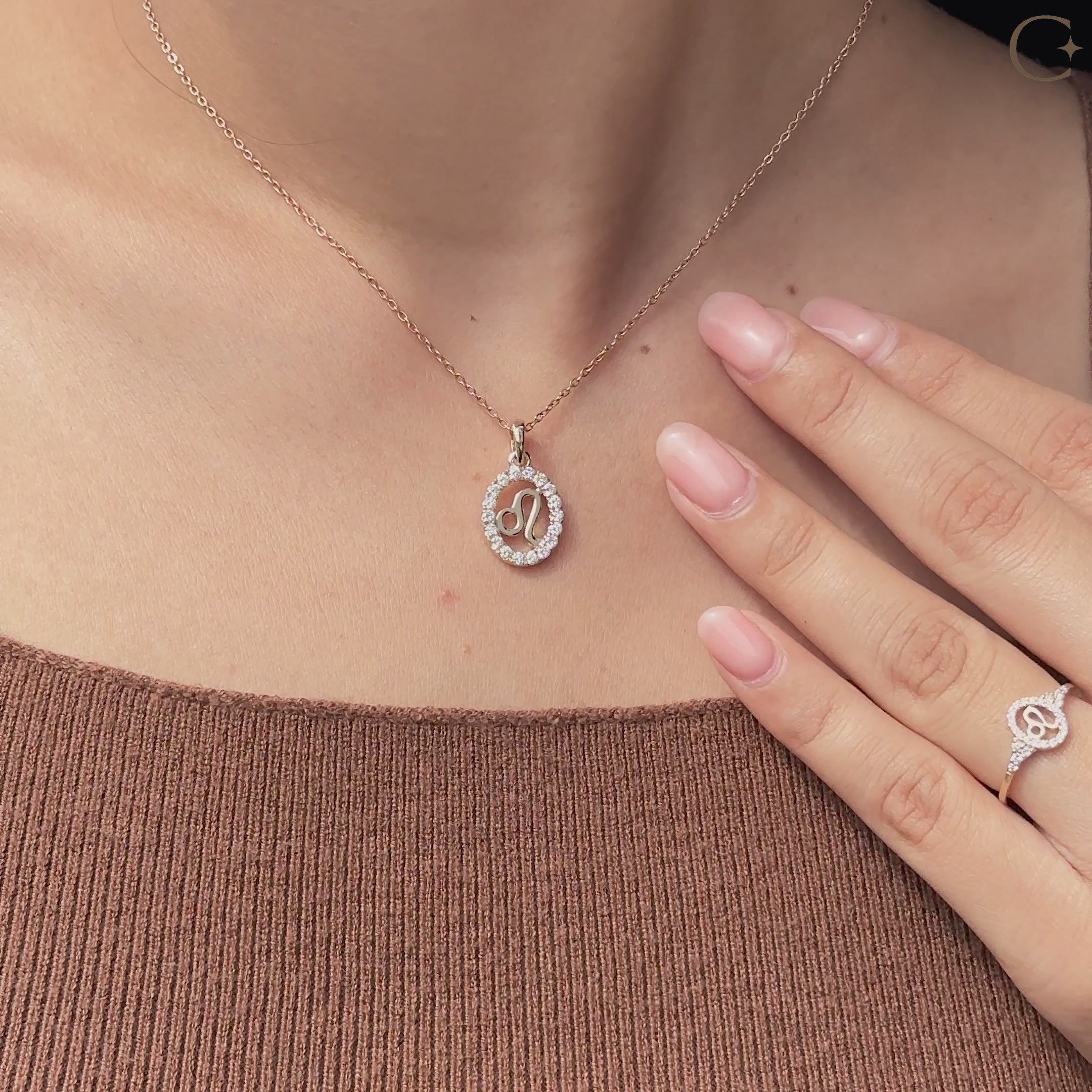 Handmade Leo pendant in yellow gold with halo diamond design.