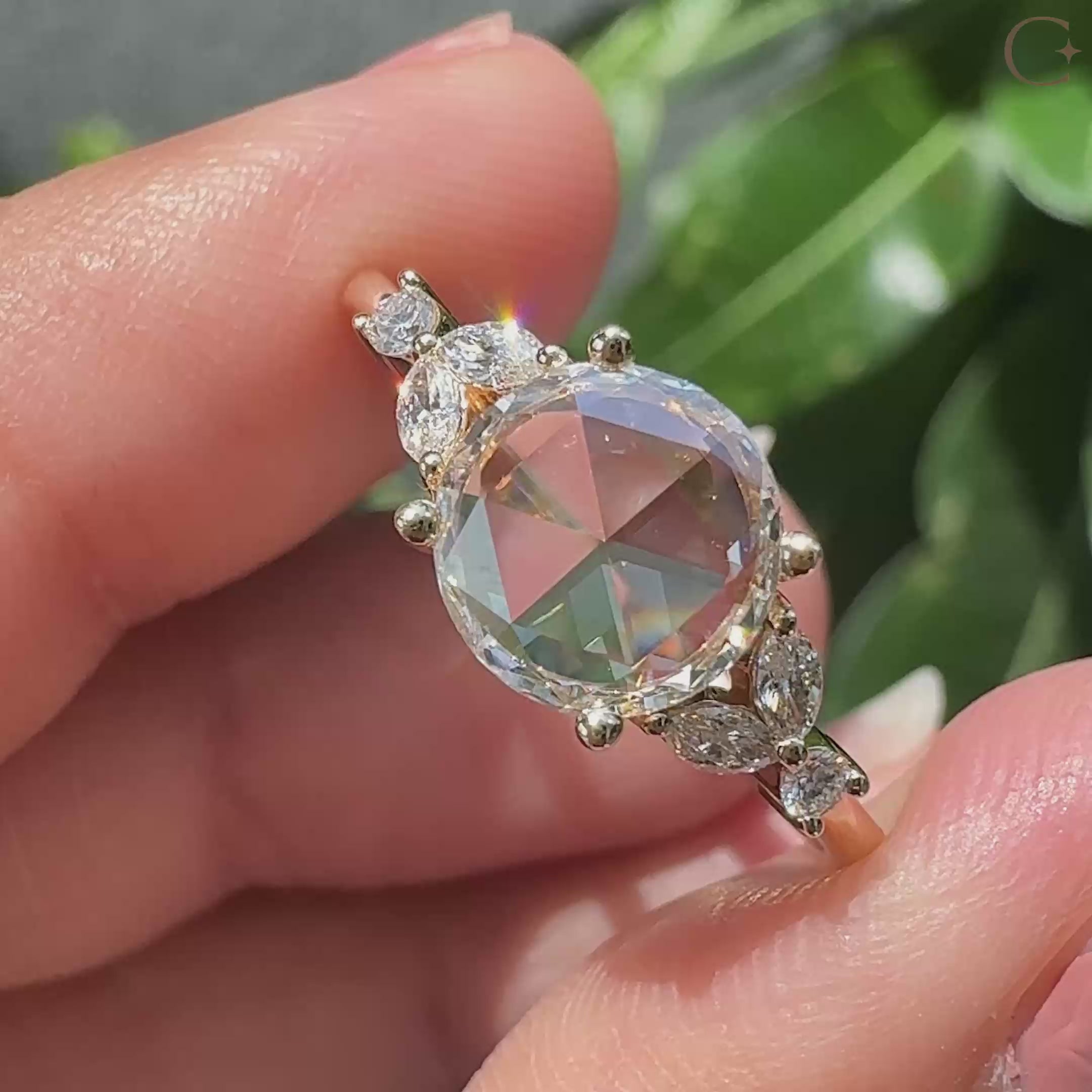 Marquise and round side stone in muse setting ring.
