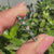 Round cut diamond and emerald gemstone half eternity band.
