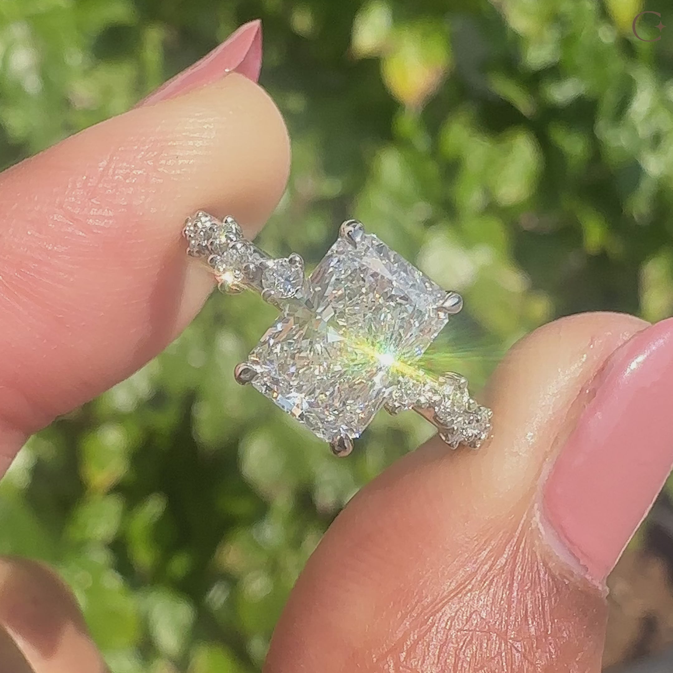 Radiant cut ring with hidden halo setting brilliance.
