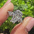 Coffin diamond engagement ring with tulip setting and accents
