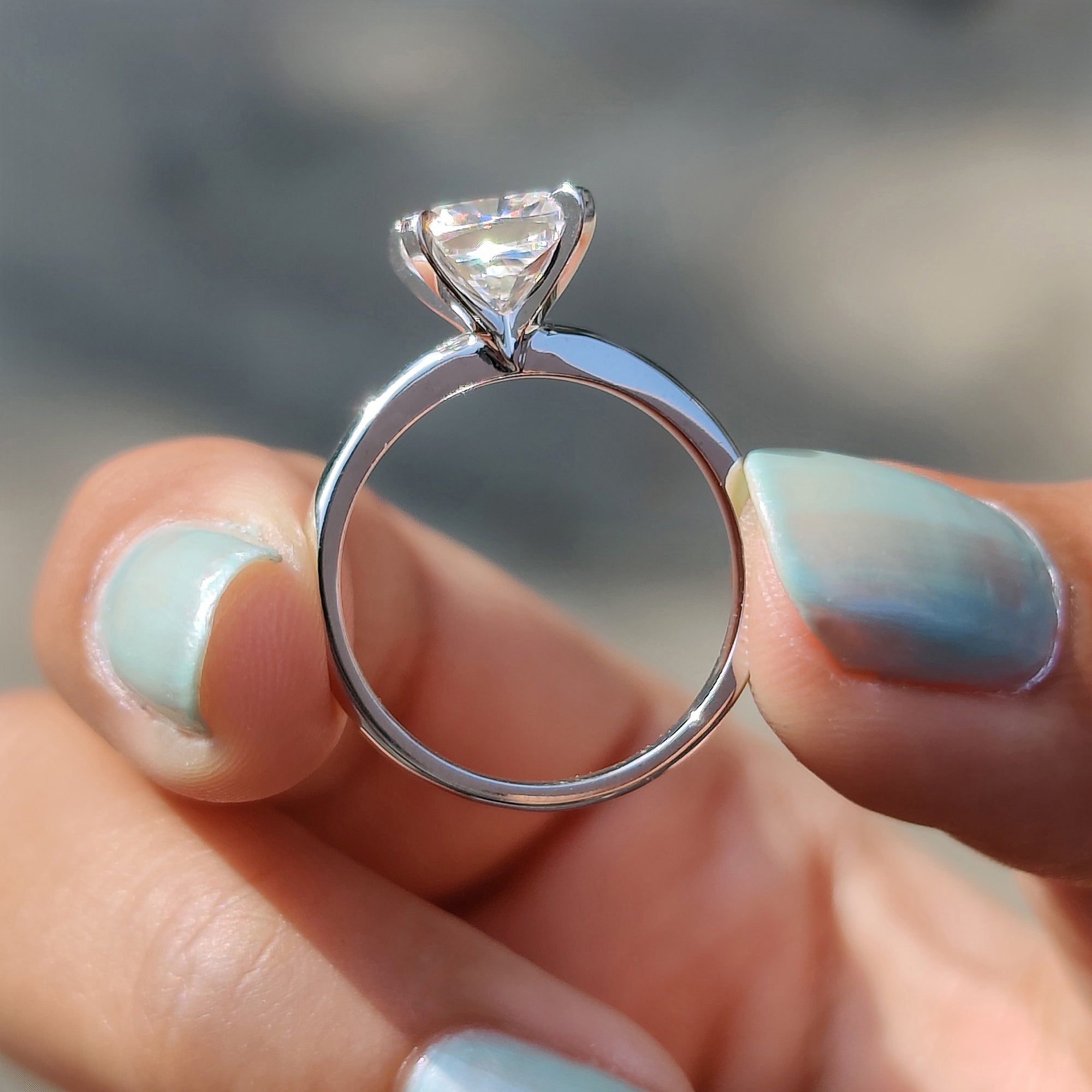 Custom moissanite engagement ring in white gold.
