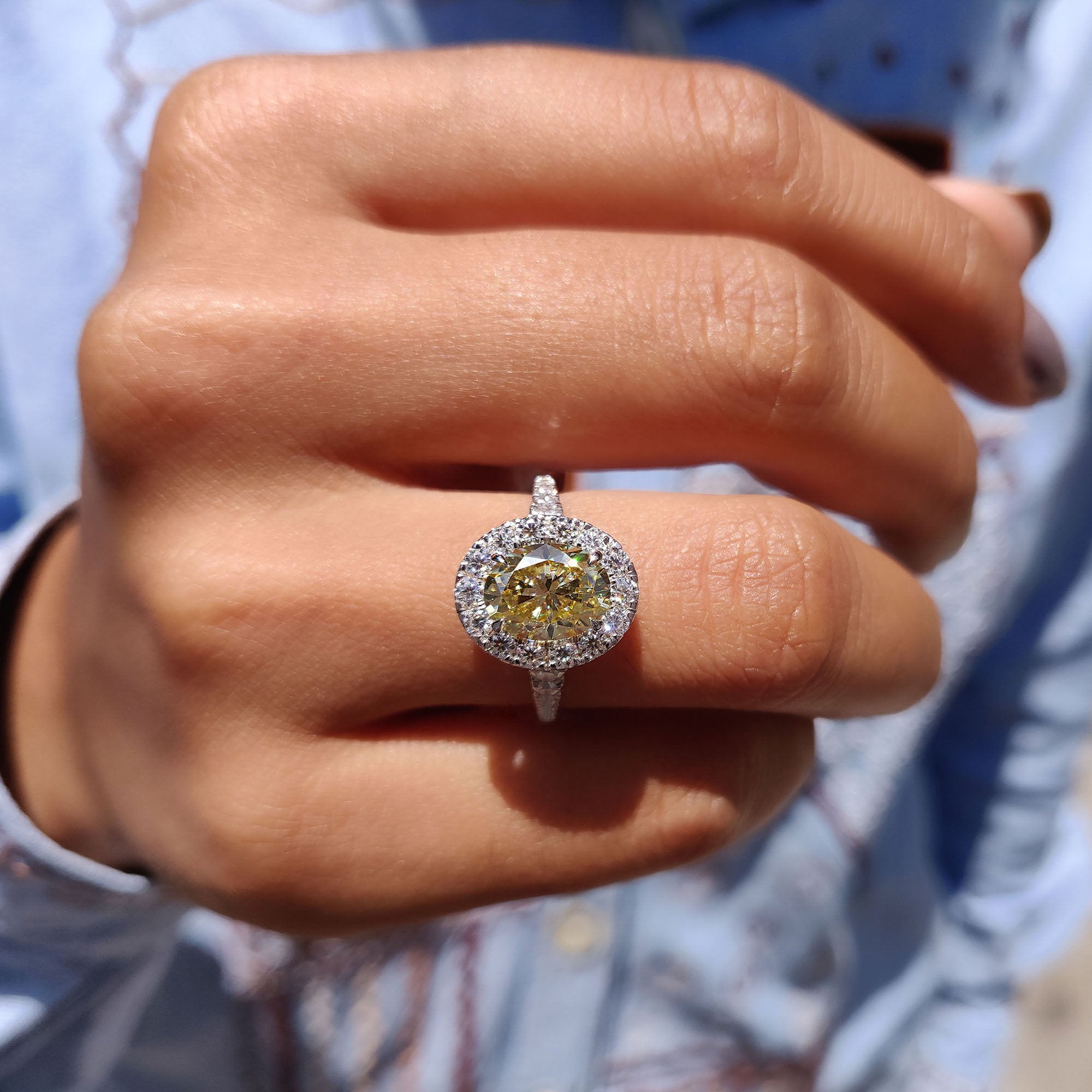 Moissanite halo ring featuring a micro pave band.