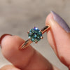 This round solitaire engagement ring offers a timeless, elegant design.
