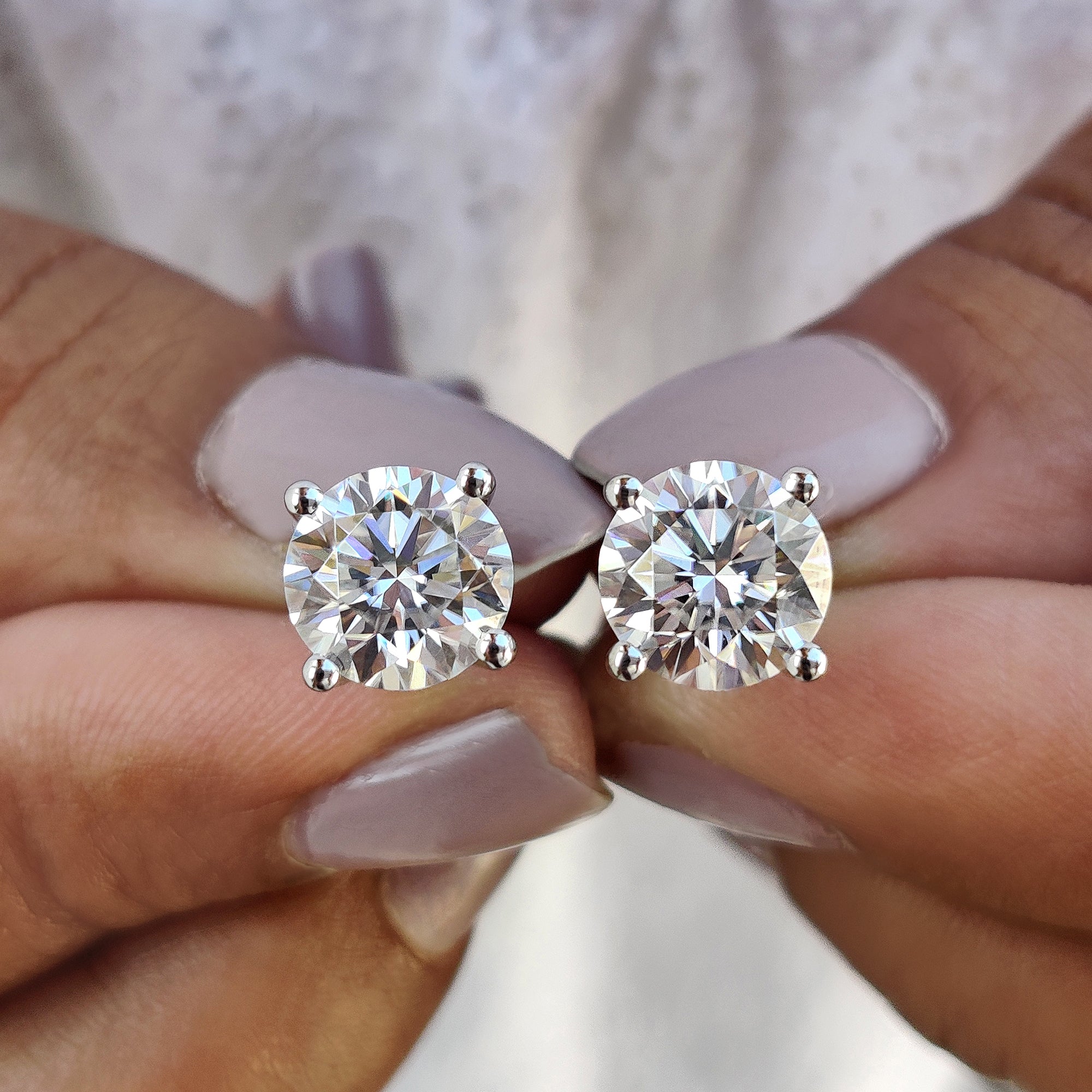 Moissanite Stud Earrings designed with 4 prong setting and handmade jewelry craftsmanship.
