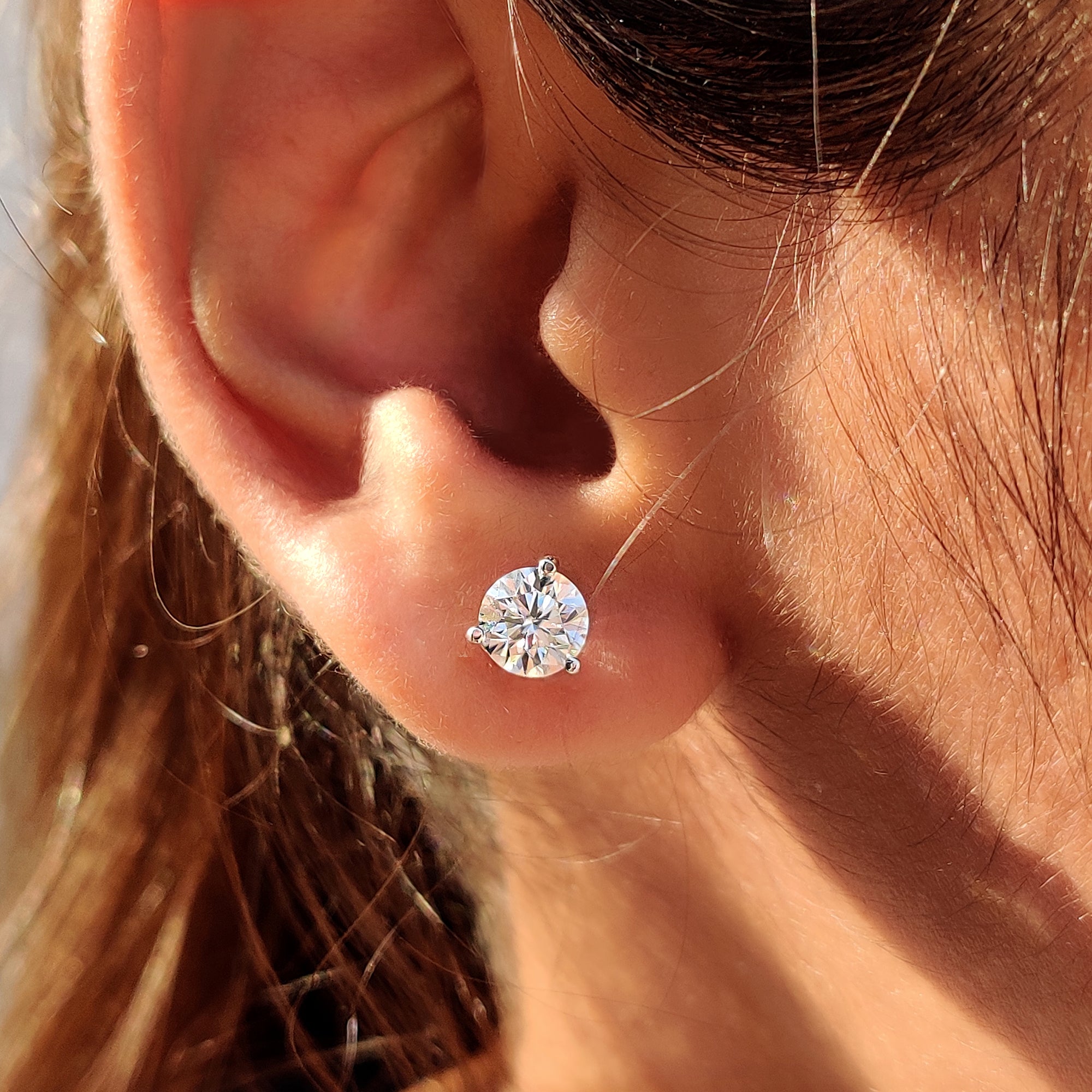 Moissanite Stud Earrings paired with white gold earrings and 3 prong setting.
