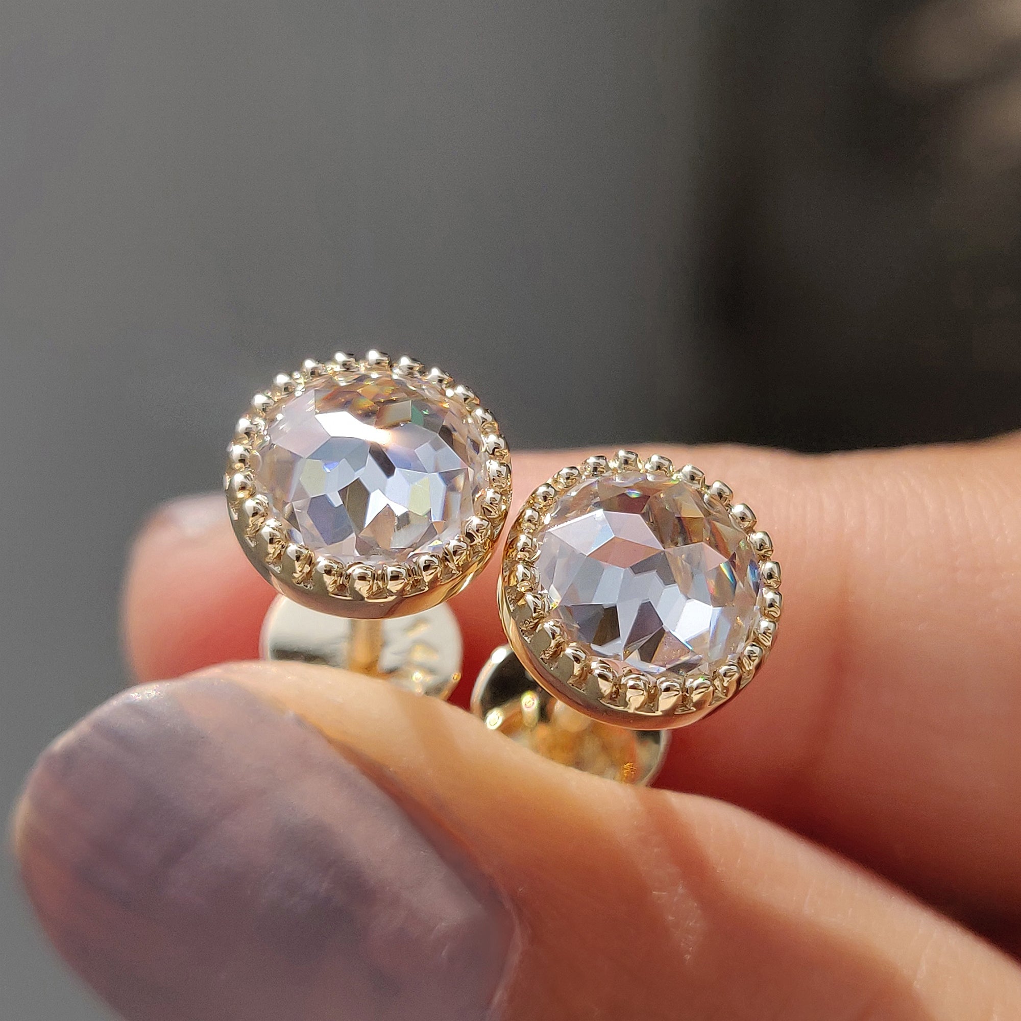 Round rose cut Moissanite Earrings crafted in yellow gold earrings with screw back earrings for secure wear.
