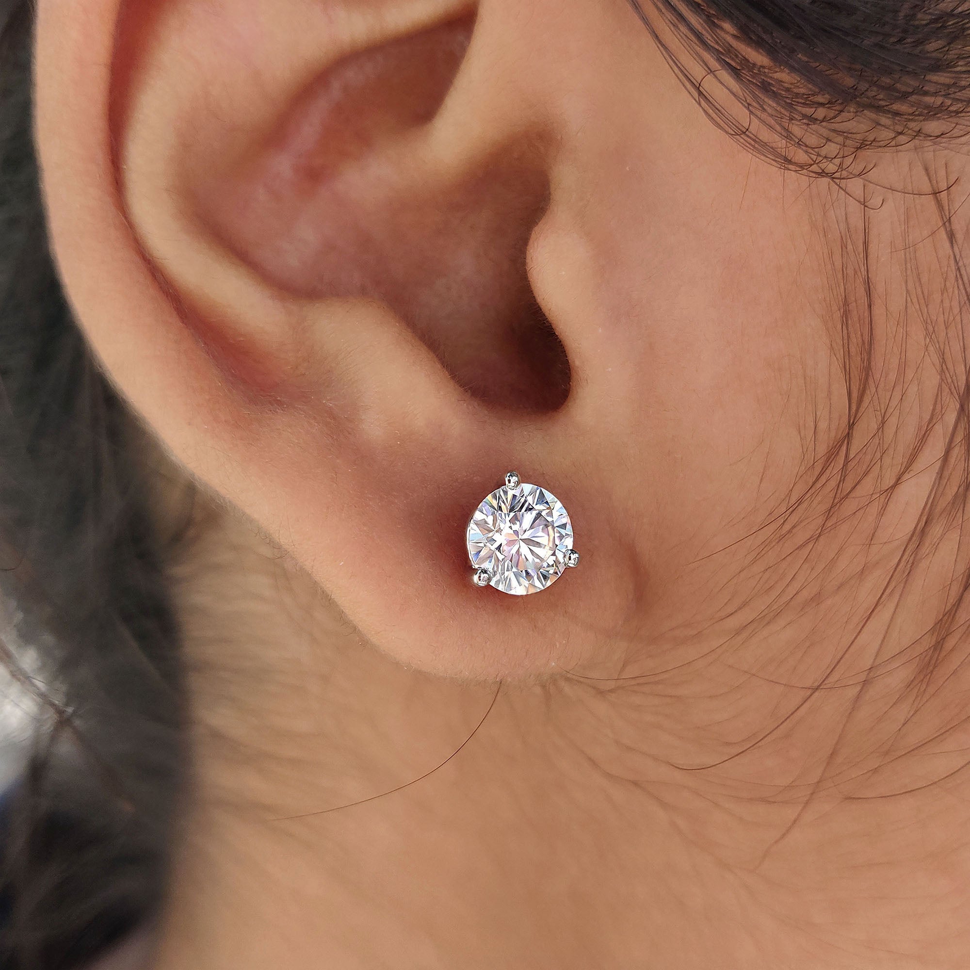 White gold earrings paired with 3 prong setting and stud earrings style.

