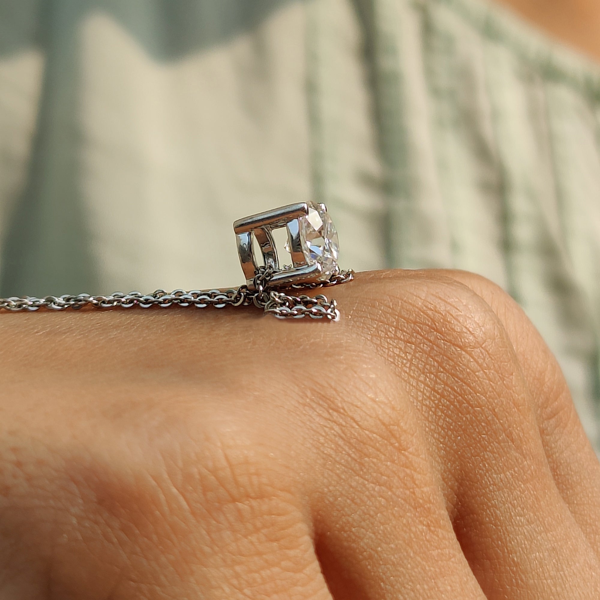 White gold pendant crafted as a round Cut moissanite pendant for special occasions.
