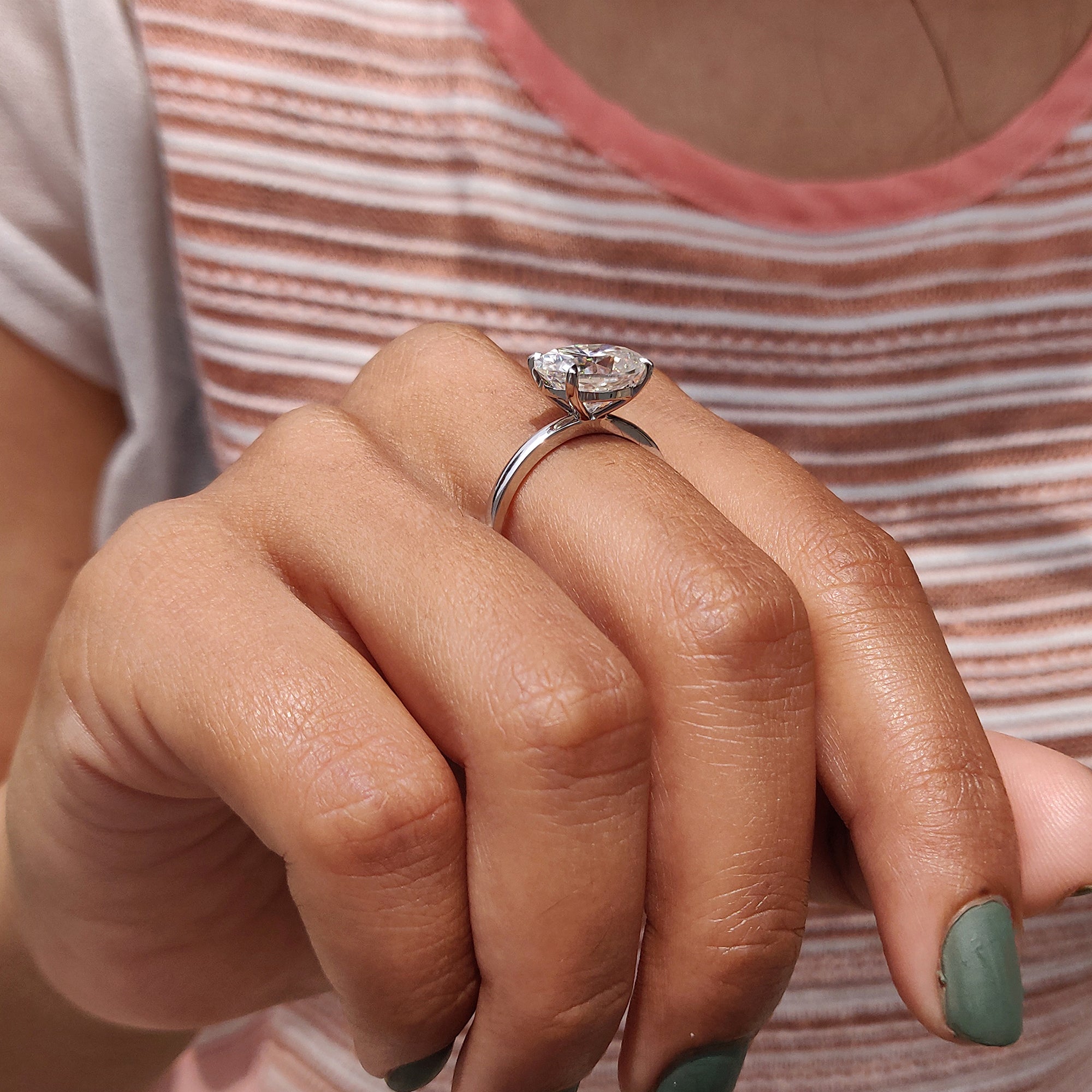 Oval cut ring in a white gold solitaire design.