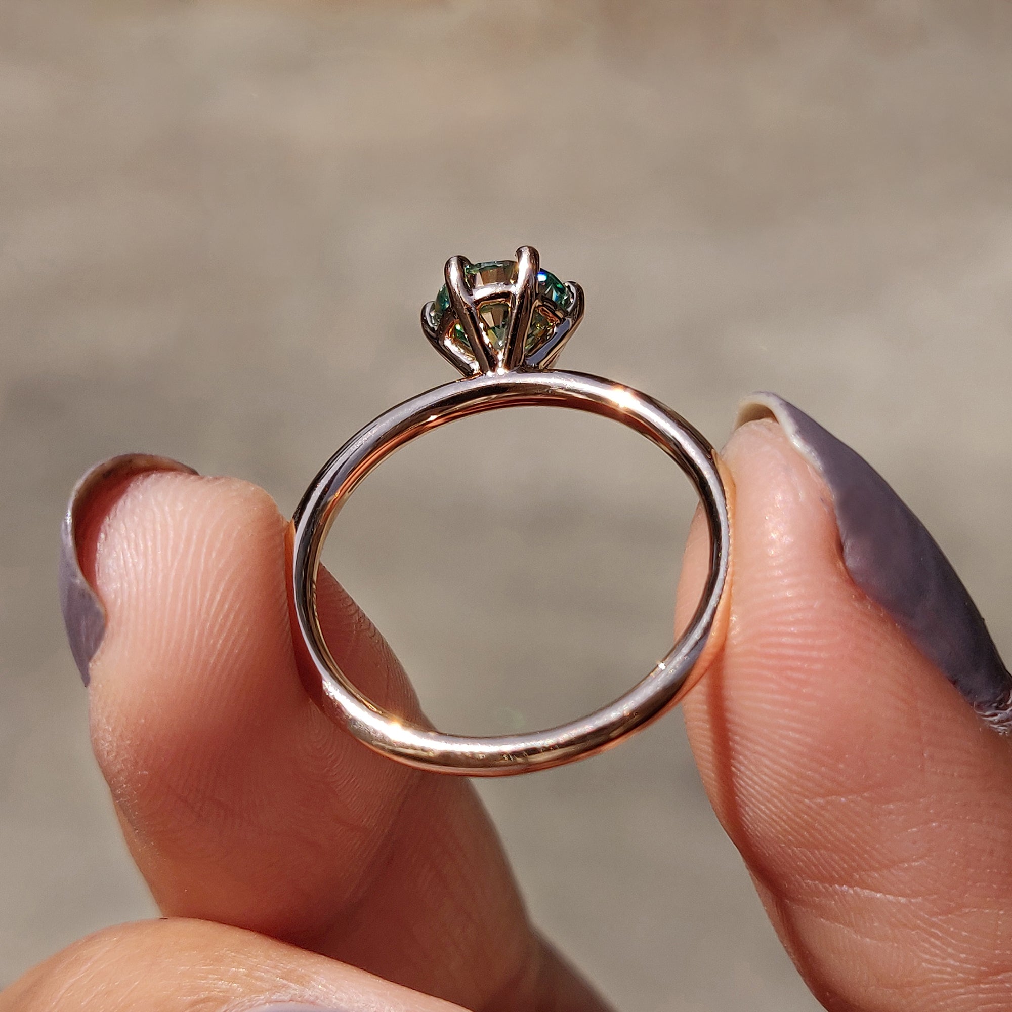 A solitaire round cut ring highlights the beauty of a single gemstone.
