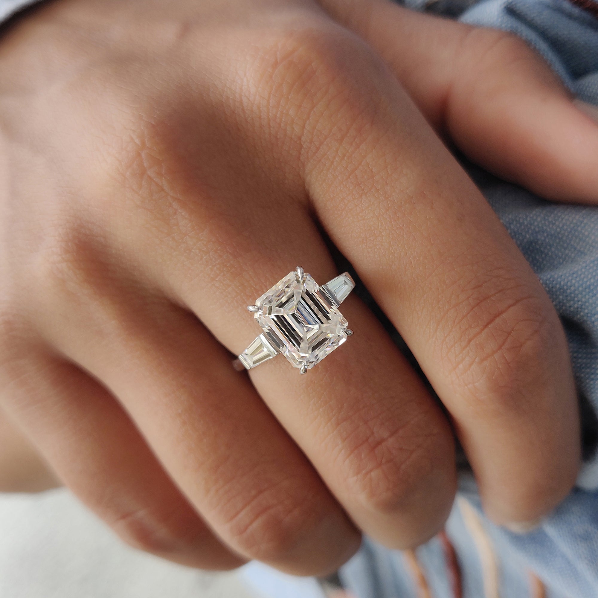 An emerald cut engagement ring provides a sophisticated, classic design.