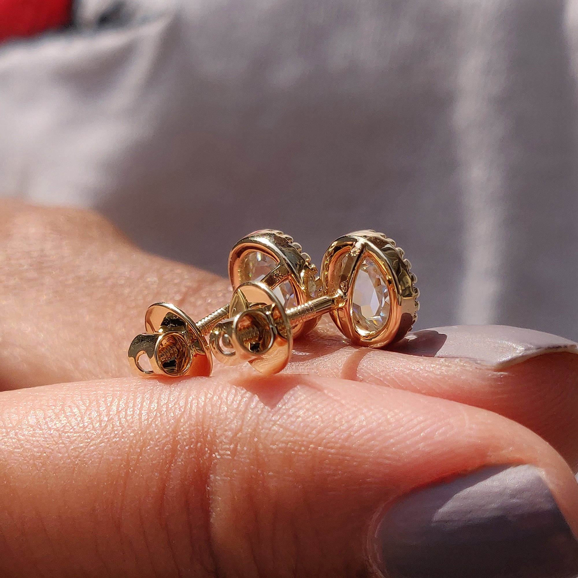 Bezel set stud earrings made from Moissanite Earrings in Stud Earrings style.
