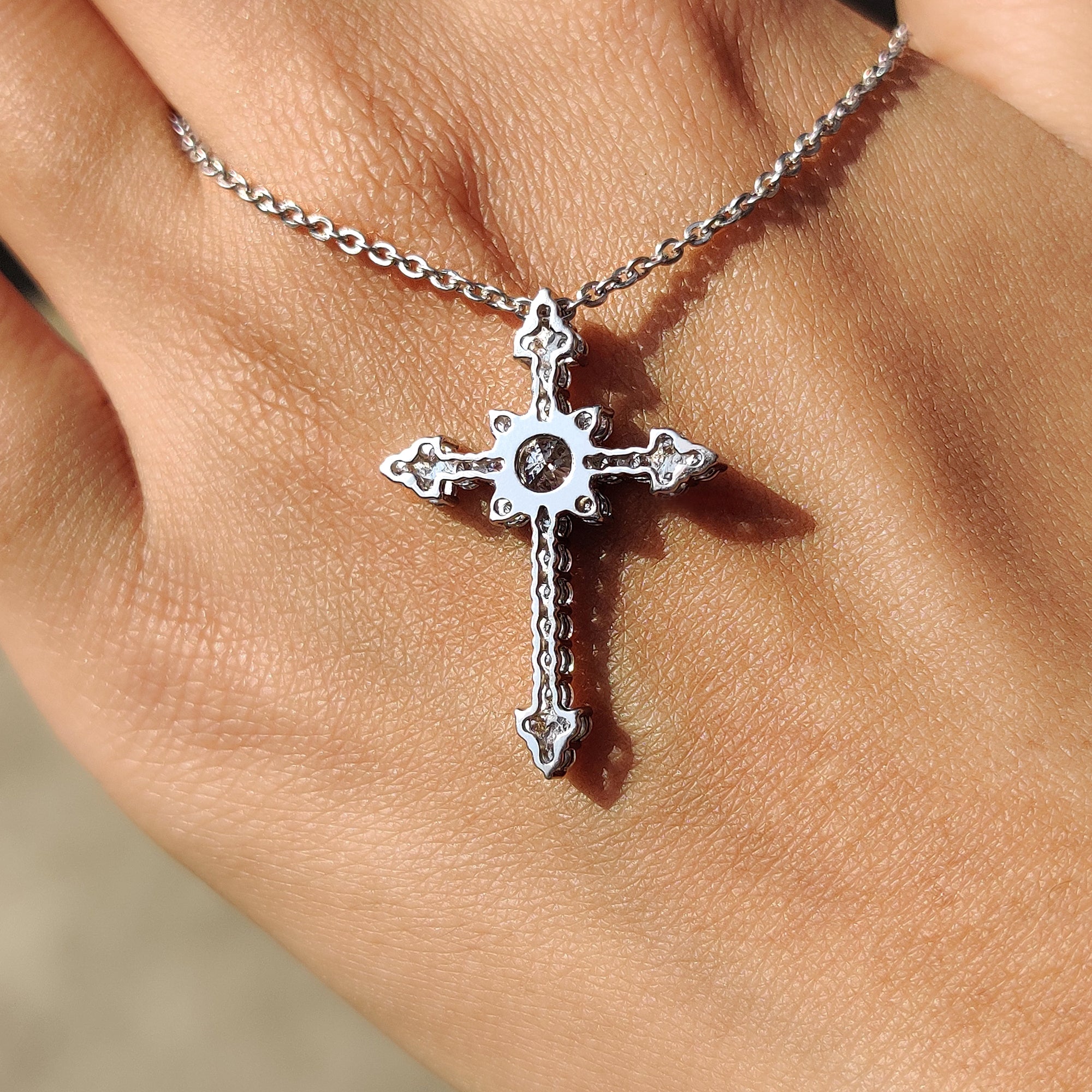Anniversary Gifts for Her include a cross pendant and criss cross moissanite pendant.
