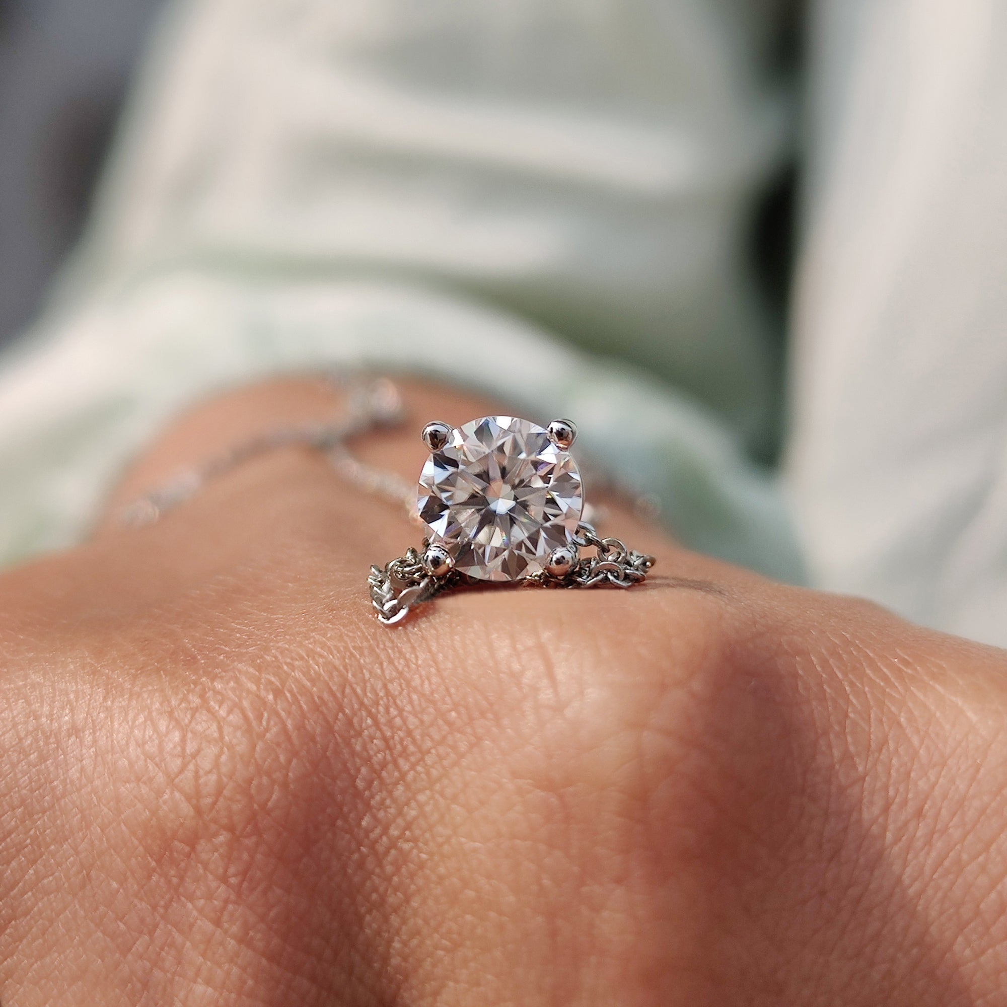 Round Cut moissanite pendant designed as a round Cut Wedding pendant in white gold pendant.
